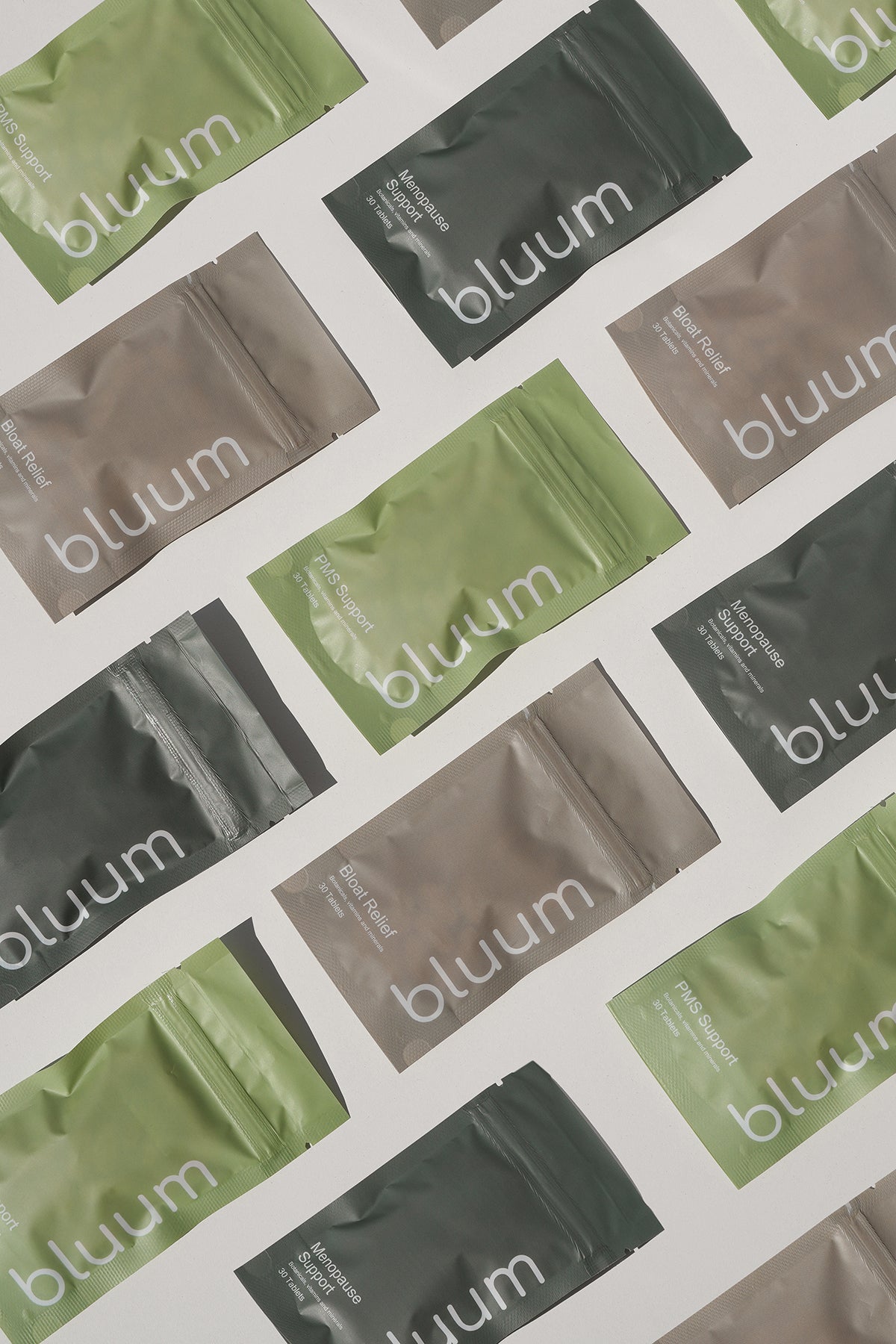 Flat-lay of Bluum plant-based women's supplement pouches